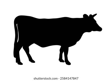 A cow stands strong, a symbol of resilience and simplicity. Nature's quiet beauty in a single silhouette