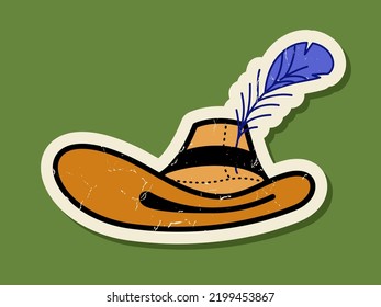 Cowboy hat with feather. Old sticker with scuffs on a green background.