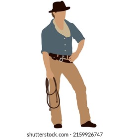 Cowboy in a hat stands with a lasso in his hand