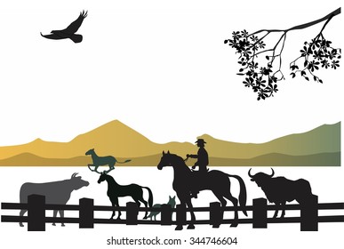 Cowboy at his rancho silhouettes of animals and cowboy on horse on mountain silhouettes background