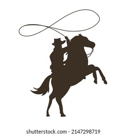 cowboy lassoing in horse silhouette