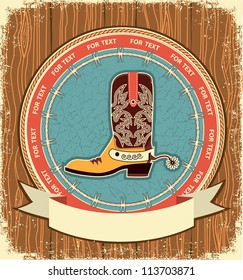 Cowboy shoe.Western label background on old wood texture