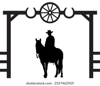 A cowboy is sitting astride his horse under a gate entrance archway in silhouette