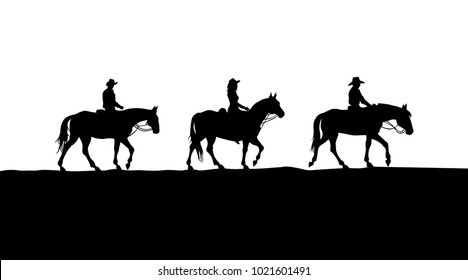 cowboys riding in prairie