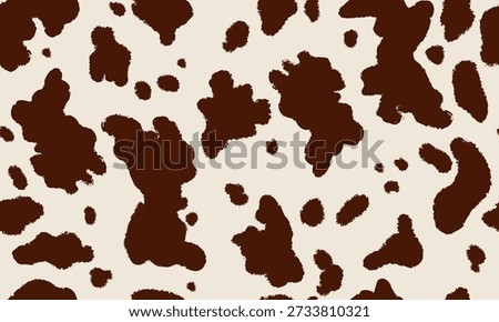 Cowhide animal print seamless pattern in brown and cream tones. Cow skin spots repeating texture. 