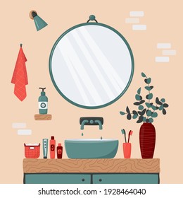 Cozy Bathroom Interior. Blue Sink On Wood Counter With A Large Round Mirror Hanging Above It. Vase With Eucalyptus Branches. Toothbrush, Body Care Cosmetics, Towel