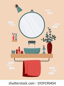 Cozy Bathroom Interior. Blue Sink On Wood Counter With A Large Round Mirror Hanging Above It. Vase With Eucalyptus Branches. Toothbrush, Body Care Cosmetics, Towel