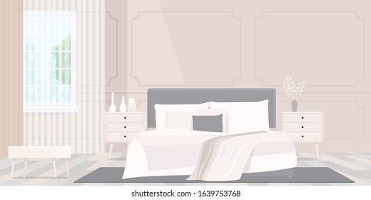 Cozy beige colored blanket on king size bed in bright bedroom