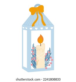 Cozy blue lantern with a burning candle and leaves, berries inside isolated on white background, time for hygge, home decoration for holiday