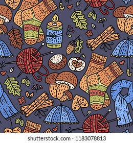 Cozy fall hand drawn vector seamless pattern. Autumn doodle detailed illustration with coziness ornate elements - mushrooms, clothes, acorn, thread, knitting, candle, chestnut and more.