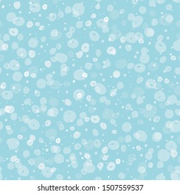 Cozy festive falling snow seamless vector pattern. Scattered transparent dots and spots on pastel blue background. Perfect for packaging, Christmas and New Years projects, cards, greetings and