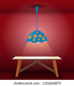 Cozy illuminated ceiling lamp lighting a wooden table in empty room
