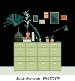 Cozy interior, black wall, frames on the wall, chest of drawers, stacks of books, succulents, table lamp, glass bottle, monstera leaf, ficus, succulents. Vector flat illustration.