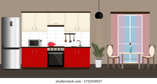 El acogedor interior de la cocina y del comedor. Mobiliario de cocina y electrodomésticos.