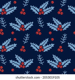Cozy knitted christmas seamless pattern with holly leaves and red berries