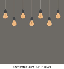 Cozy lightbulbs on brown background. Free space for text. 