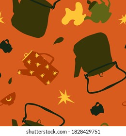 Cozy magical tea kettle, jug, teapot, cups, drops and stars in warm autumnal colors on orange background