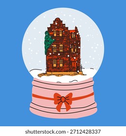 Acogedor edificio de ladrillo rojo dentro del globo de nieve con copos de nieve
