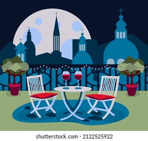 Cozy restaurant on rooftop with table and two chair in the old city Rome with the cityscape evening or night