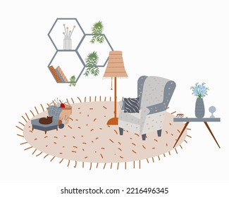 Cozy room interior with hygge style. A large armchair, hot tea, a figurine, flowers in a vase, on the fireplace, a knitting basket, a sleeping cat on an ottoman, a floor lamp, a stylish shelf with boo