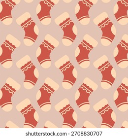 Cozy seamless pattern with cute Christmas stockings in flat festive style on a soft beige background. Great for wrapping paper, textile and holiday designs.