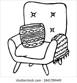 Cozy soft armchair with a pillow and a blanket. Single doodle vector illustration. Hand drawn.