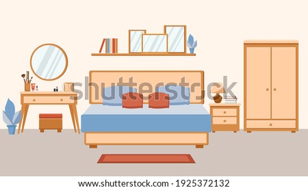 Cozy trendy bedroom interior. Large double bed, dressing table and wardrobe
