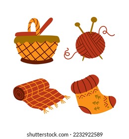 Cozy warm collection. A ball of thread for knitting, a plaid, a basket, a sock. Home comfort. Vector cartoon isolated on white background.