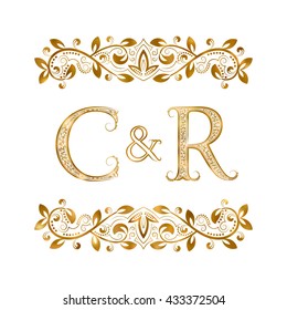 C&R vintage initials logo symbol. The letters are surrounded by ornamental elements. Wedding or business partners monogram in royal style.