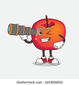 Crab Apple cartoon mascot character using a monocular