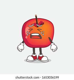 Crab Apple cartoon mascot character with crying expression