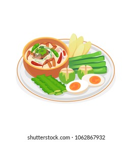 Crab dip with coconut milk served with fresh vegetables.