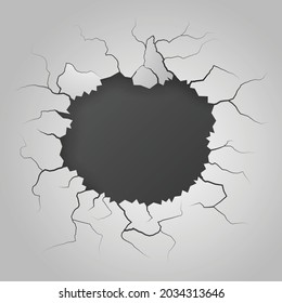cracked hole in the white wall