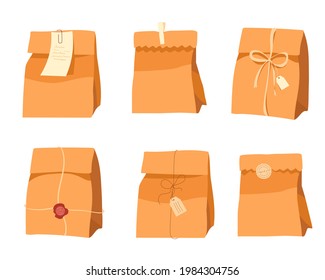 Craft bags. Kraft shopping bags. Set of paper gift bags with stickers, ribbons, stamps and tags. Recycled bulk paper bags without handles. Vector illustration isolated on white 