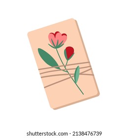 Craft gift box on an isolated background. A small gift, decorated with a flower branch.