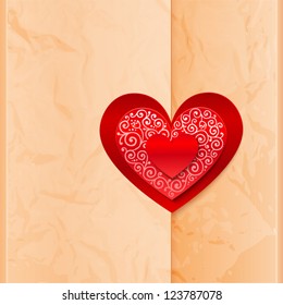 Craft paper folder closed by ornate heart sticker