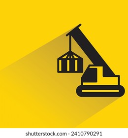 icono del equipo de grúa con sombra sobre fondo amarillo