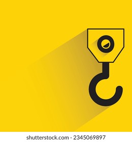 crane hook with shadow on yellow background