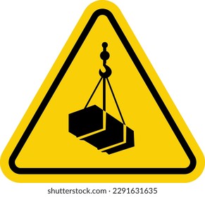 Crane sign. Crane warning sign with suspended load. Yellow triangle sign with a crate attached to a hook inside. Caution crane, stay clear of suspended loads. Loading cargo. Overhead crane.