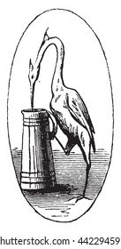 At the crane, vintage engraved illustration. Magasin Pittoresque 1852.

