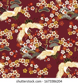 CRANES AND COLOR SAKURA.Colorful floral seamless pattern with flowers, japanese bird. Vector traditional folk fashion ornament on  burgundy background.