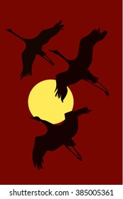 cranes at sunset