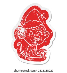 crazy quirky cartoon distressed sticker of a monkey sitting wearing santa hat