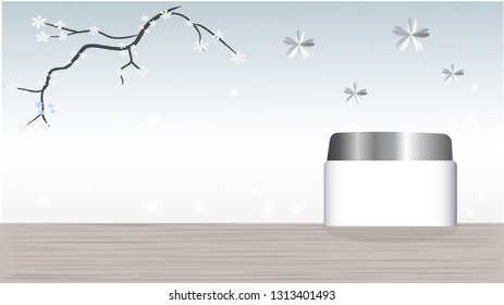 A cream jar is on the silver background.
