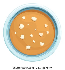 Creamy peanut butter is spread in a blue bowl, creating a delicious and visually appealing treat