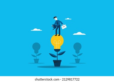 Creating ideas business creative idea concept . Business man with pot watering light bulb tree.