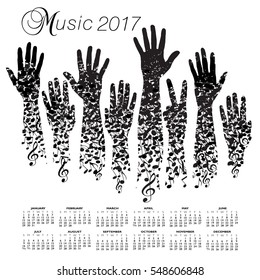 A creative 2017 musical calendar made with hands and notes