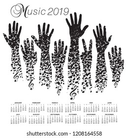 A creative 2019 musical calendar made with hands and notes 