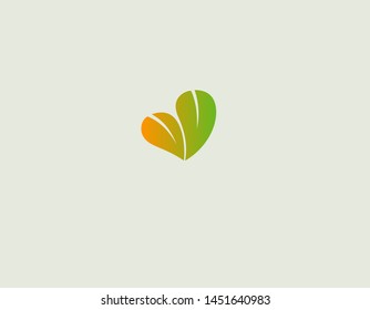 Creative Abstract bright logo green heart of two leaves of a plant