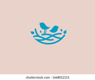 Creative blue logo birds perched on a branch for your company